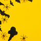 Halloween flat lay. Bats, spiders, ghosts decoration on yellow background. Happy Halloween template - PhotoDune Item for Sale