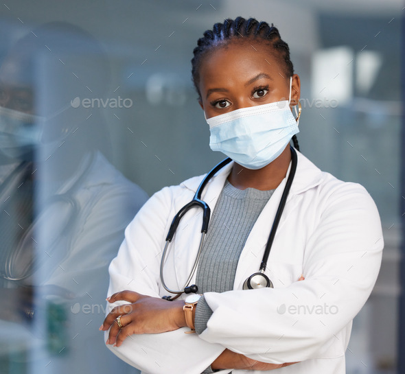 Keeping everyone around me safe. Shot of a young doctor wearing a mask.