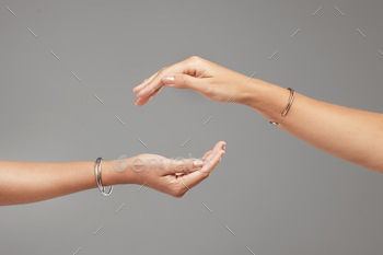 Cropped shot of two unrecognizable women posing with their hands cupped above each other