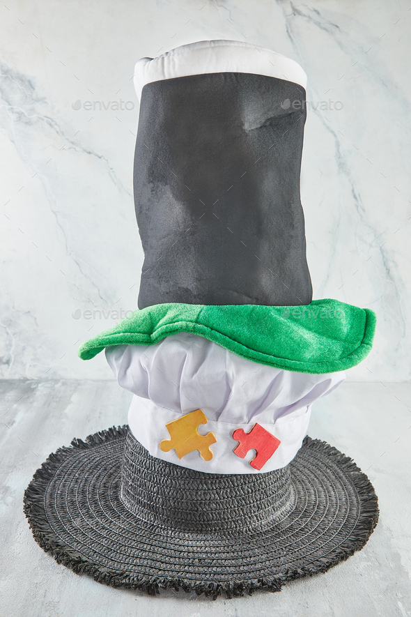 Wizard\'s hat, chef\'s hat and sun hat on a wooden background