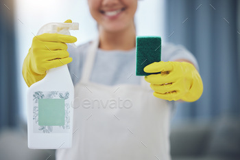 Lets see what these can do. Shot of an unrecognizable person holding a bottle and sponge at home.