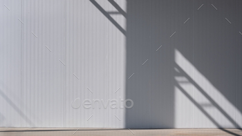 Sunlight and shadow on gray sandwich panel of cold storage wall in freezer warehouse industry area