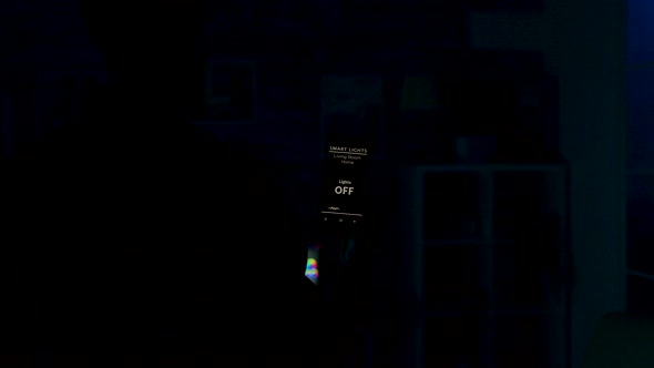Man Uses Voice Activated Smart Lights App on His Smartphone To Tun on the Lights in the House alt