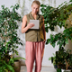 Young blond woman in casualwear holding tablet while networking in office - PhotoDune Item for Sale