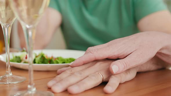 Hands of Loving Senior Couple alt