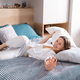 Happy woman fighting with pillows - PhotoDune Item for Sale