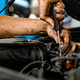 Close up of auto mechanic repairing car engine in car service - PhotoDune Item for Sale