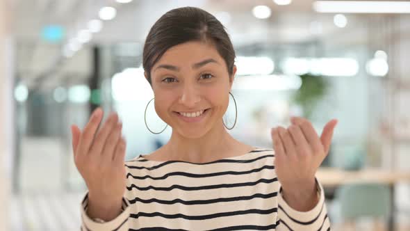Portrait of Curious Indian Woman with Pointing and Inviting  alt