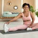 Domestic sports concept. Happy fit black lady in sportswear doing fitness exercises on yoga mat - PhotoDune Item for Sale