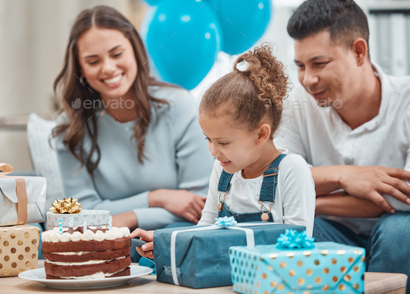 Have your cake and share it too. Shot of a happy family celebrating a birthday at home.