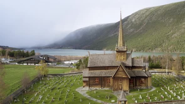 Exterior Of Lom Stave Church In Innlandet County, Norway - aerial drone shot alt