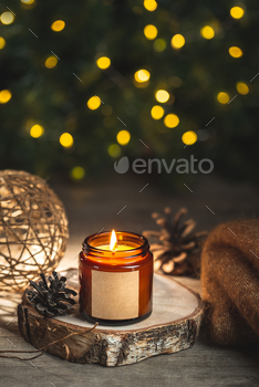 Holiday candle in a glass jar with label mock up
