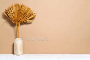 Vase with palm dry leaves