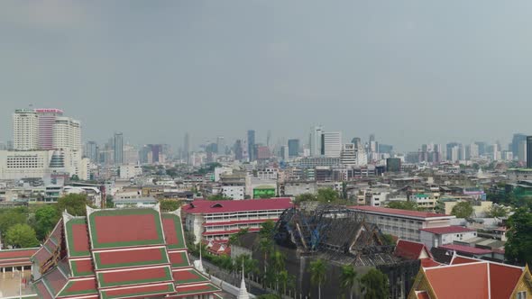 4K Urban landscape shot of a panoramic view of Bangkok, Thailand on a sunny day, from the top of the alt
