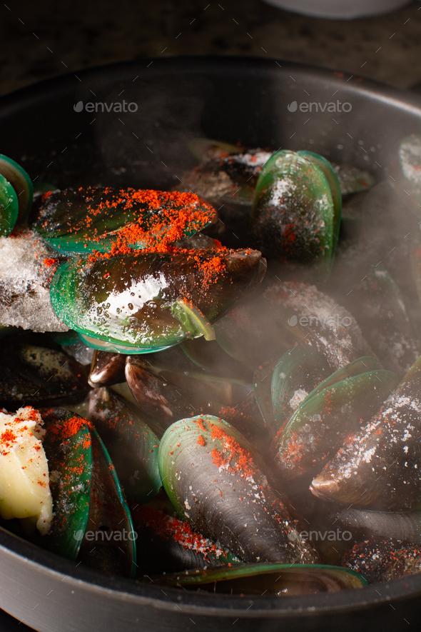 Steamed mussels with paprika and wine. Served with french fries. Seafood. sea shells aphrodisiac f