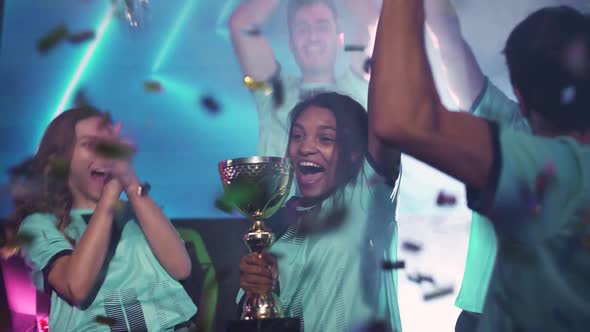 Emotions of Victory the Blue Team of Esports Players Rejoices at the Victory in the Championship alt