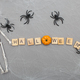 the inscription halloween with spider web and spiders on a gray background with a skeleton - PhotoDune Item for Sale