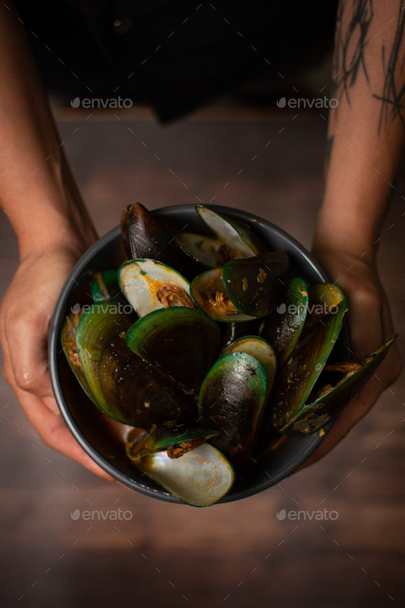 Steamed mussels with paprika and wine. Served with french fries. Seafood. sea shells aphrodisiac f