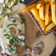 Fries and fillet of beef with mushroom sauce in background - PhotoDune Item for Sale