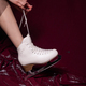 girl white ice skates red background winter - PhotoDune Item for Sale