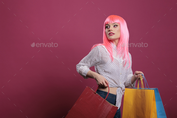 Happy adult holding shopping bags bought on sale discount