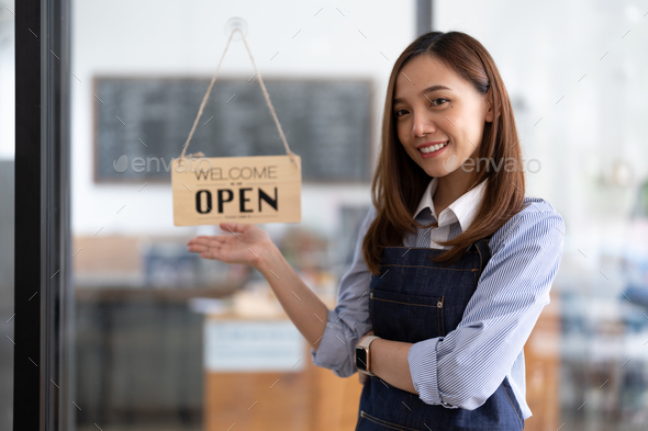Welcome open shop barista waitress open sign on glass door modern coffee shop ready to serve
