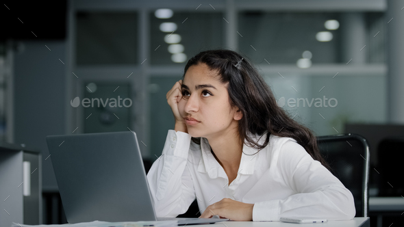 Sad bored lazy young woman typing on laptop tired unmotivated businesswoman office worker feels