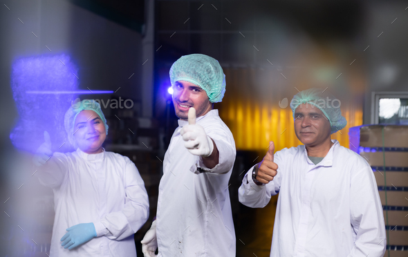 A team of scientists at the fruit juice factory Get ready for the day\'s work