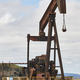 Oil pumping machine. Pump jack. Petroleum extraction. Global warming - PhotoDune Item for Sale