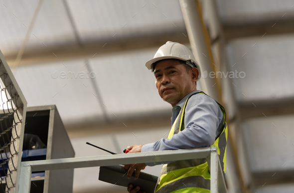 Warehouse Manager with the role of managing and controlling products - Stock Photo - Images