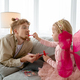 Little daughter putting lipstick on dads lips - PhotoDune Item for Sale