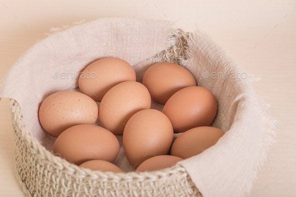 Chicken Eggs in a Basket. Healthy Food Concept. Source of Vitamin B, Omega-3, Folic Acid