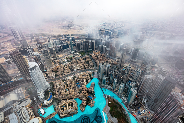 Dubai UAE aerial rooftop view from Burj Khalifa in clouds. - Stock Photo - Images