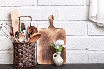Kitchen Loft Background with Tools. Crockery on a Tabletop against a White Brick Wall