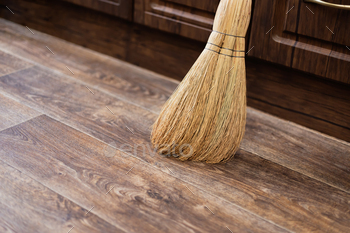 Cleanliness and Order at Home, a Broom of Sorghum for Sweeping is on the Floor, Cleaning Equipment
