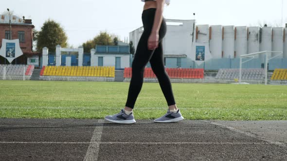Slim Fit Asian Runner in Sportswear Starts Running From Block on Stadium Track alt