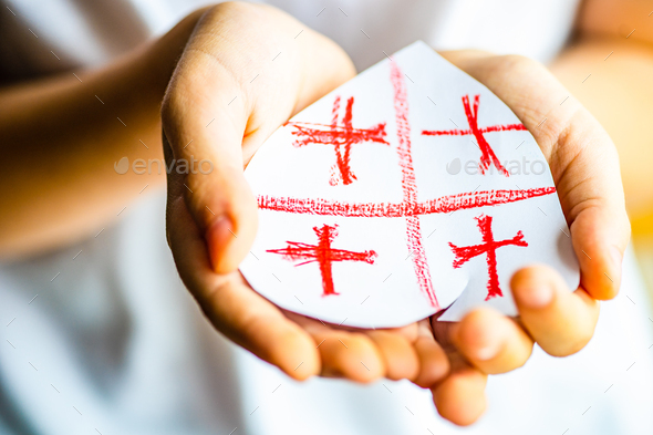 Kid hands with heart shaped flag