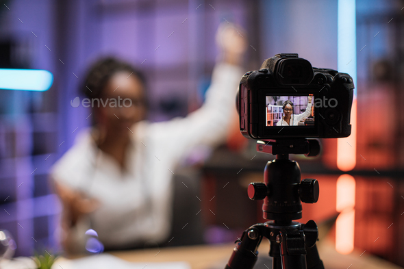 View of video camera screen with attractive confident african american ...