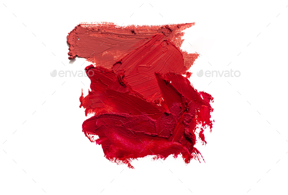Lipstick smear smudge swatch isolated on white background. Colorfull red lipstick texture.