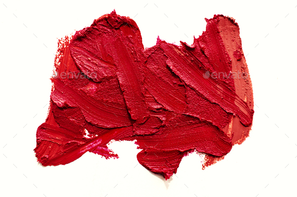 Lipstick smear smudge swatch isolated on white background. Colorfull red lipstick texture.