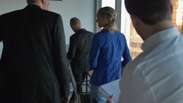 Black Skin Afro-american Boss Encourages His Colleagues with Boxes and Documents and Electronics alt