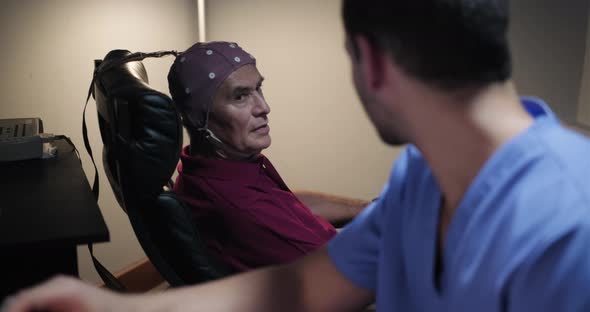 Elderly male patient with Alzheimer's illness, undergoing electroencephalogram examination 