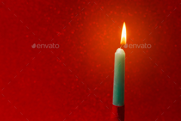 burning green and red candle