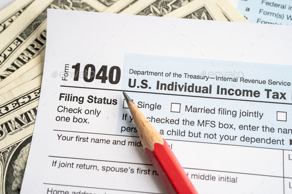 Tax Return form 1040 with USA America flag and dollar banknote, U.S. Individual Income.