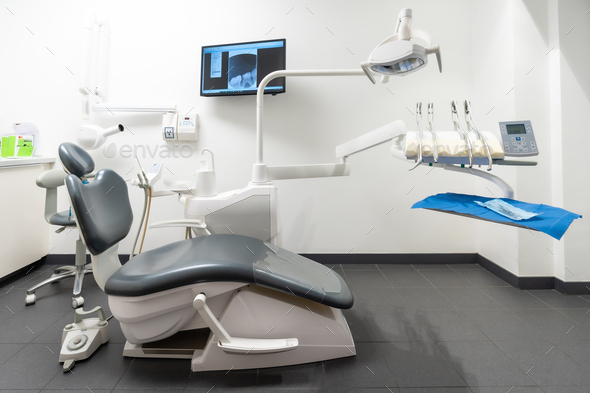 Modern dental practice. Dental chair, medical light, dental clinic without people