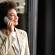 Pretty african american business woman talking on her mobile phone - PhotoDune Item for Sale