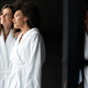 Women in bathrobes enjoying tea and wellness weekend - PhotoDune Item for Sale