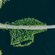Aerial view of road through blue lakes or sea with green woods in Finland. - PhotoDune Item for Sale