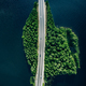Aerial view of road through blue lakes or sea with green woods in Finland. - PhotoDune Item for Sale