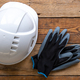 Work helmet and gloves on a wooden background, top view. - PhotoDune Item for Sale